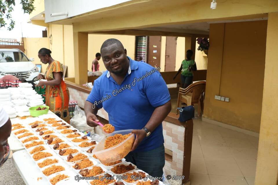 Ing. Bernard Lemawu, Founder of Amlalo Charity Foundation helping to serve the meals.