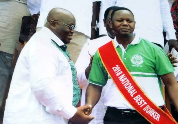 Mr Edward Kareweh, General Secretary of the Ghana Agricultural Workers Union, being congratulated by President Nana Addo Dankwa Akufo-Addo after receiving the award for the Overall Best Worker for 2018.