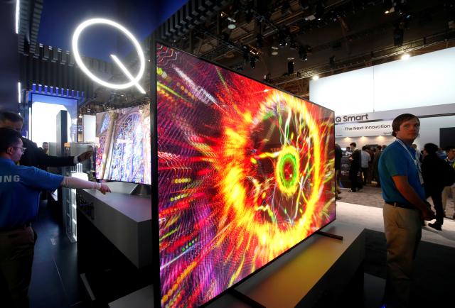 FILE PHOTO: Samsung QLED televisions are displayed during the 2017 CES in Las Vegas, Nevada January 5, 2017. REUTERS/Steve Marcus/File Photo