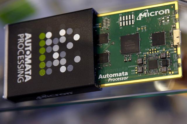 FILE PHOTO: Memory chip parts of U.S. memory chip maker MicronTechnology are pictured at their booth at an industrial fair in Frankfurt, Germany,  July 14, 2015.  REUTERS/Kai Pfaffenbach/File Photo
