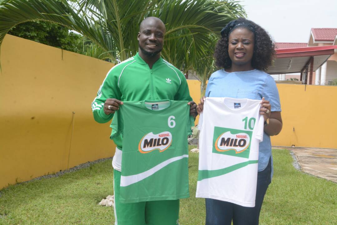 Marilyn Ofori (Category Business Manager, Beverages, Nestlé) and Stephen Appiah (Milo U-13 Icon) launch new sets of jerseys for the final match of the Milo Under 13 Champions League 2018.