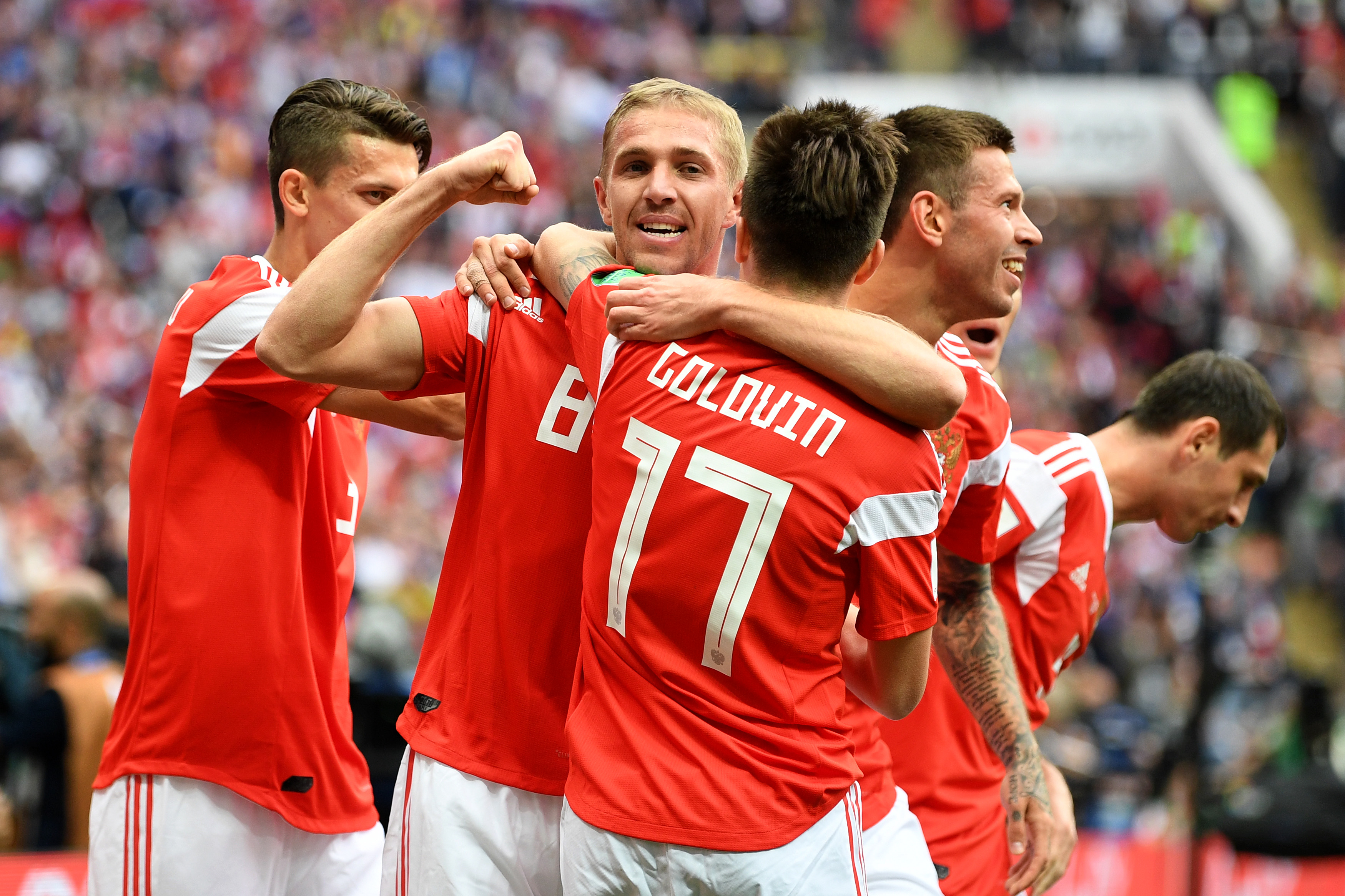 MOSCOW, RUSSIA - JUNE 14: Iury Gazinsky of Russia celebrates with teammates after scoring the opening goal during the 2018 FIFA World Cup Russia Group A match between Russia and Saudi Arabia at Luzhniki Stadium on June 14, 2018 in Moscow, Russia.  (Photo by Michael Regan - FIFA/FIFA via Getty Images)