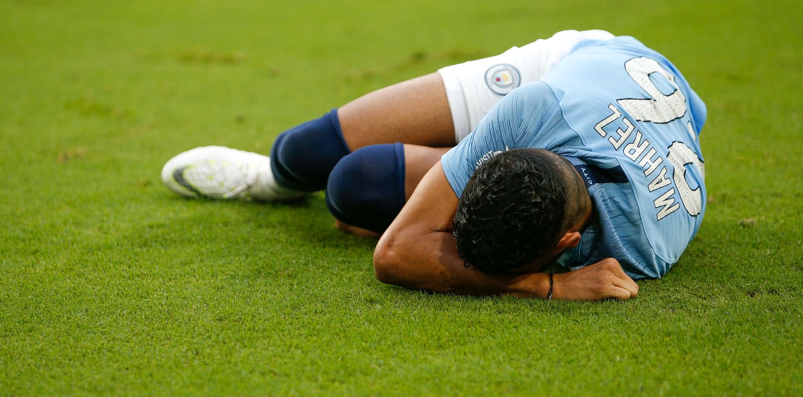 MIAMI, FL - JULY 28:  Riyad Mahrez #26 of Manchester City reacts after being injured against Bayern Munich during the first half of the International Champions Cup at Hard Rock Stadium on July 28, 2018 in Miami, Florida.  (Photo by Michael Reaves/Getty Images)