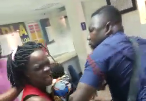 Outrage as police officer beats up woman holding baby