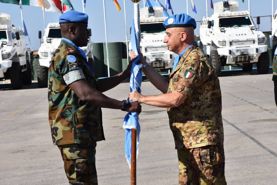 Sector west commander hands over the UN flag to Lt Col Fiifi Deegbe commanding officer of GH 85