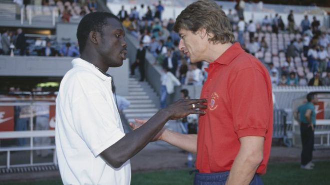 George Weah (left, pictured here in 1993) has said that Arsène Wenger (right) "took care of me like his son"
