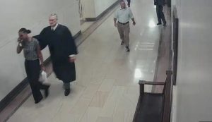 Judge resigns after video shows him grabbing Black woman around the neck