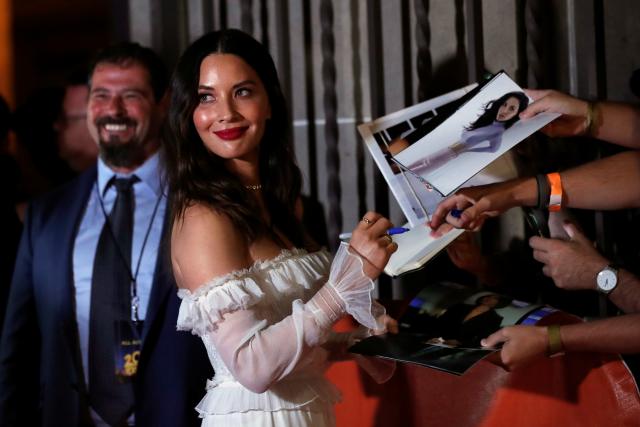 Olivia Munn signs autographs at the premiere of The Predator.

REUTERS/Mario Anzuoni