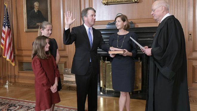 Brett Kavanaugh, surrounded by his family, was administered the judicial oath by outgoing justice Anthony Kennedy