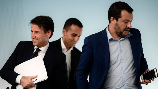 Prime Minister Giuseppe Conte (L) and his two deputies - Luigi Di Maio and Matteo Salvini (R) - have been told to revise their budget