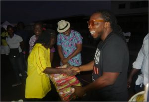 Snappy Snack’s brand ambassador, Edem, presents items to Black Queens