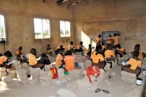 Pupils of Abalato primary use cement blocks as tables