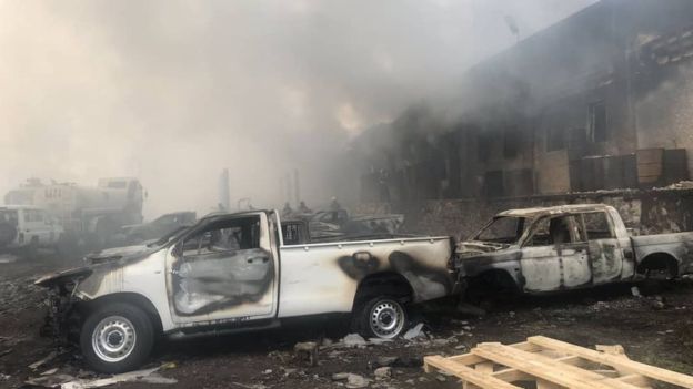 A photo released by the election commission shows vehicles damaged by the fire