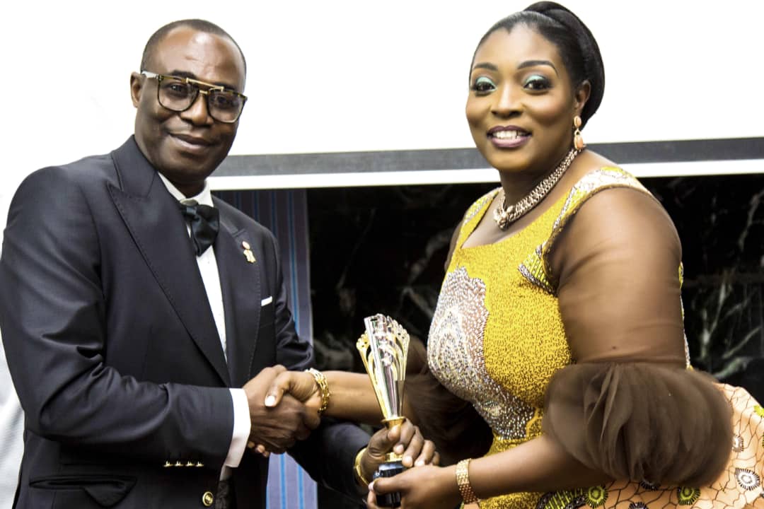 Dr. Brown Osei Konada (L) receiving Pan African Top Brands Eminence Awards from CEO of Sidalco Group, Prof. Gifty Akushika Lamptey