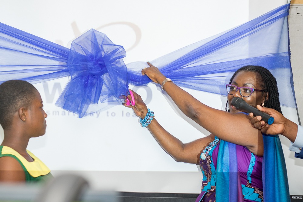 Mrs. Owusu-Ekuful cutting the ribbon for the e-learning project