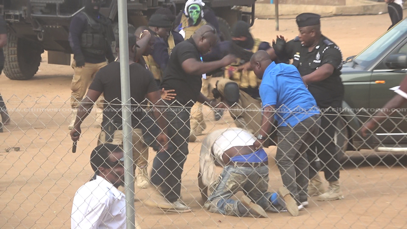 File photo: Security personnel beating a man during the by-election