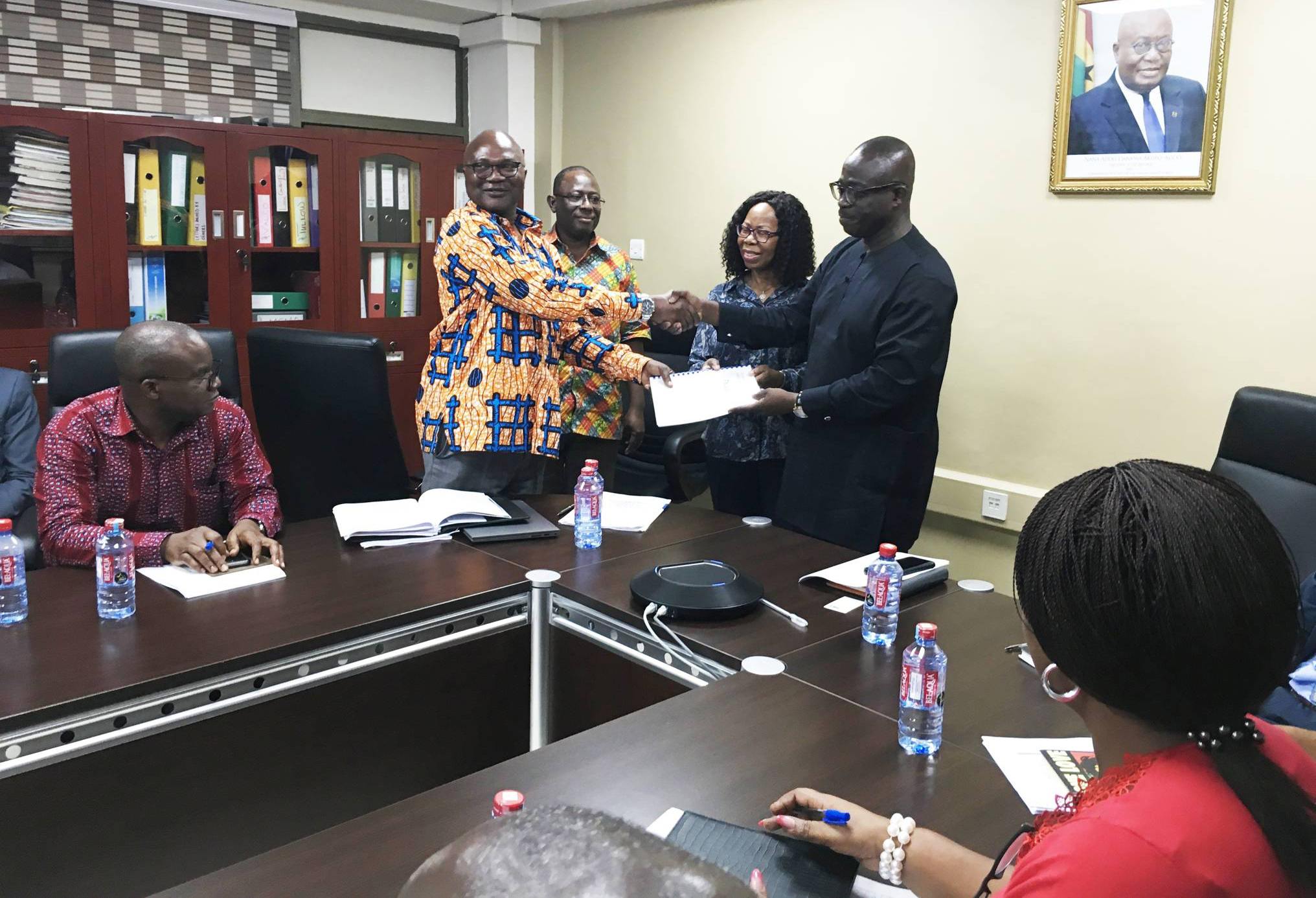 Dr. Alfred Ofosu Ahenkorah, Executive Secretary of the Energy Commission presenting the Renewable Energy Master Plan to the Deputy Minister of Energy in charge of Power, Hon. William Owuraku Aidoo