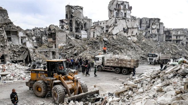 The war-damaged block was in a formerly rebel-held area that had been bombed before Syrian forces retook it