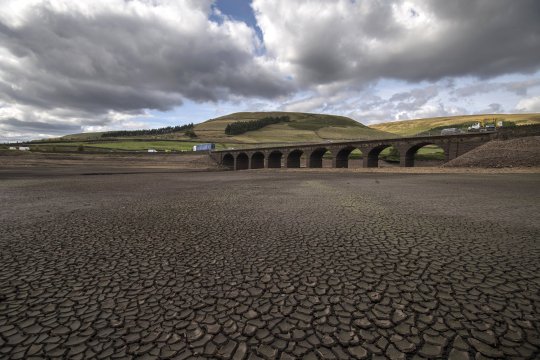 MANCHESTER, ENGLAND - SEPTEMBER 13:  Woodhead bridge on the A628 stands above the water line as the bottom of Woodhead reservoir is exposed due to low water levels in the Longdendale reservoirs following a long dry summer on September 13, 2018 in Derbyshire, England. When completed in 1877, the six mile long chain of reservoirs built by John Frederick La Trope Bateman was the largest reservoir system in the world and Europe's first major construction scheme (Photo by Anthony Devlin/Getty Images)