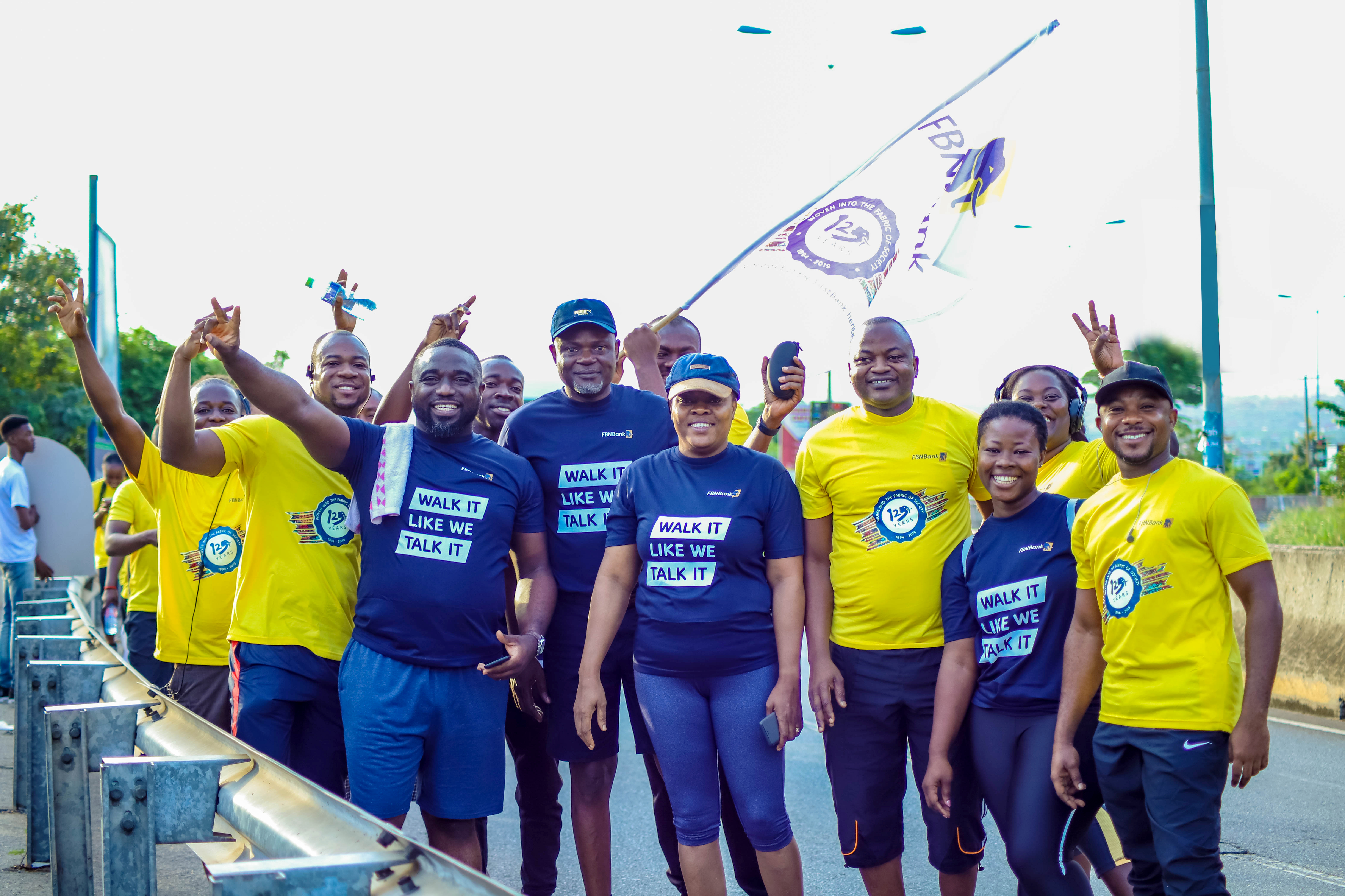 Group picture of a cross section of staff that walked are FBNBank Ghana MD, Gbenga Odeyemi, third from left, visiting Technology & Services Executive from FirstBank, Mrs. Rachel Adeshinafourth from right and FBNBank Ghana CFO, Semiu Lamidi, third from right.
