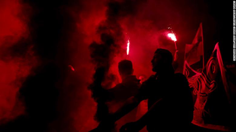 PSG fans light flares and smoke bombs outside the stadium after the UEFA Women's Champions League tie against Chelsea Women.