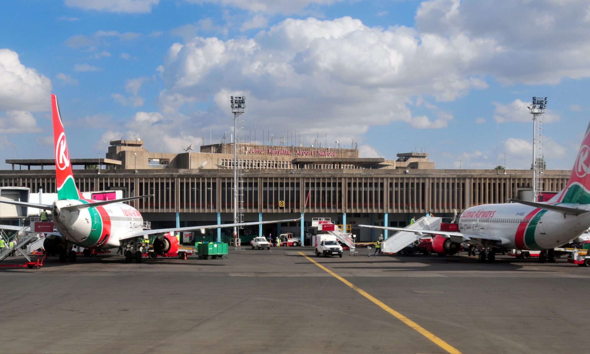 Nairobi, Kenya - August 24, 2008: Kenya Airways aircraft at the terminal building of Jomo Kenyatta International Airport