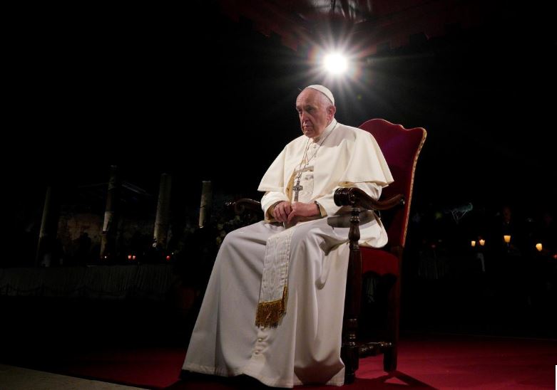 FILE PHOTO: Pope Francis presides over the Via Crucis (Way of the Cross) torchlight procession on Good Friday, in front of Rome's Colosseum, in Rome, Italy Friday, April 19, 2019. Andrew Medichini/Pool via REUTERS
