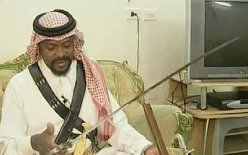 A Saudi executioner displays his sword.