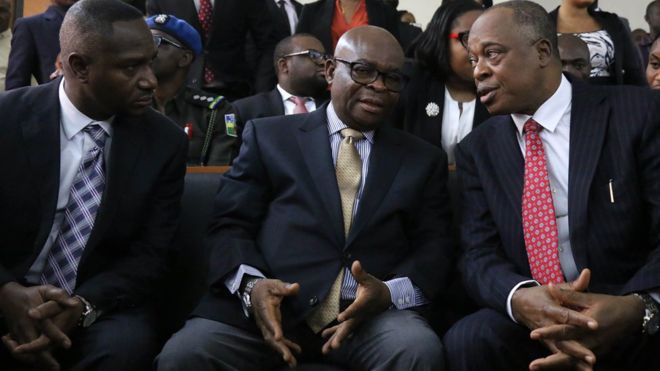Walter Onnoghen (centre) is not allowed to hold public office for 10 years