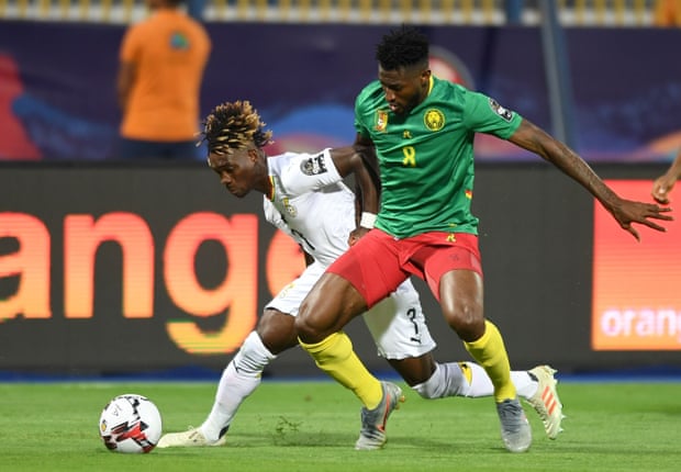 Ghana’s midfielder Christian Atsu fights for the ball with Cameroon’s midfielder Andre-Frank Zambo Anguissa. Photograph: Ozan Köse/AFP/Getty Images
