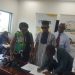 CEO of GEPA, Akua Asabea Asare and others look on as the two artistes to sign the deal.