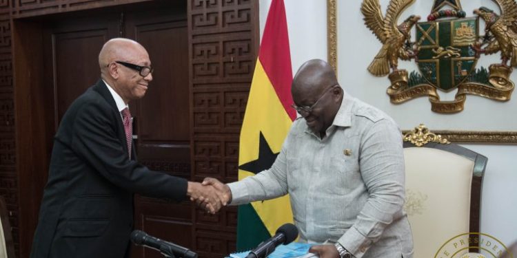 President Akufo-Addo receiving the report from Justice Emile Short