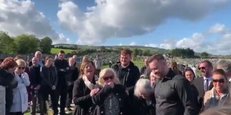 Mourners laugh as Shay Bradley's voice can be heard from beyond the grave