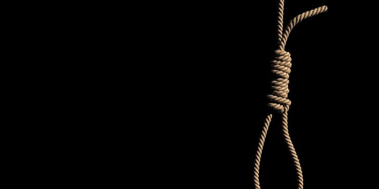 A fabric low poly suicide rope with slipknot placed on the white concrete wall with white space on left. 3D illustration and rendered by program Blender.