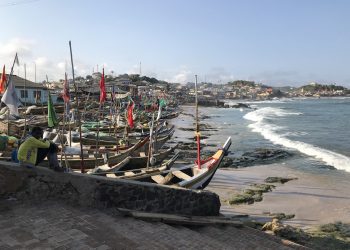 On the other side of ‘The Door of No Return’ at Cape Coast Castle, you can find docked fishing boats as you overlook the coastline