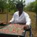 Dr Owureku-Asare at work with her solar tomato processor