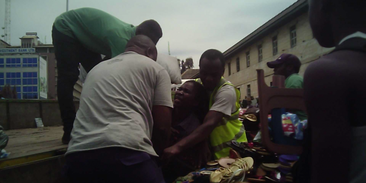 Nursing mother beaten AMA guards at Makola (2)