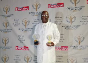 CEO of the Holy Trinity Medical Center, Dr. Felix Anyah with his two awards.
