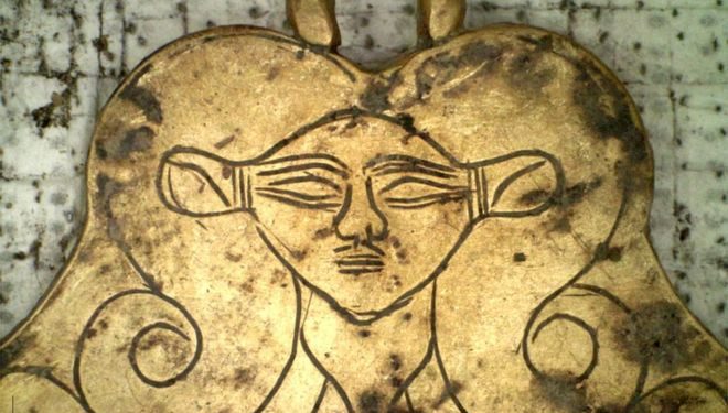 A gold pendant depicted the head of the Egyptian goddess Hathor - a protector of the dead