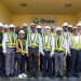 Officials of Olam pose with the GRA Delegation after the tour of the Nutrifoods facility.