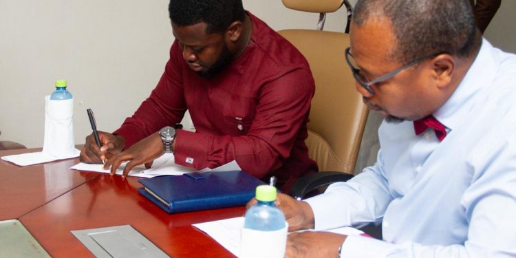 Bishop Gideon Titi-Ofei (Right) together with Jay Hyde, President of NUGS, signing the MOU