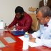 Bishop Gideon Titi-Ofei (Right) together with Jay Hyde, President of NUGS, signing the MOU