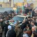 Media captionMourners surround a car carrying the coffin of Qasem Soleimani in Baghdad