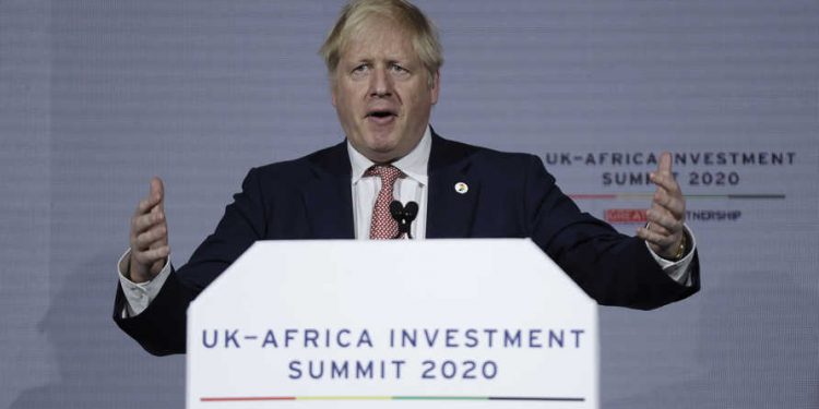 British Prime Minister Boris Johnson delivers a speech during the Opening Plenary session of the UK Africa Investment Summit in London, Monday, Jan. 20, 2020. Johnson is hosting African leaders, businesses and international institutions at the one-day summit in London. The event is taking place as Britain prepares for post-Brexit negotiations with countries around the world. (AP Photo/Matt Dunham, Pool)