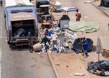 A Zoomlion truck being loaded with rubbish at Madina during the lockdown of Accra