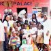 The pupils and their teachers presenting the items to the children of Gbegbeyise