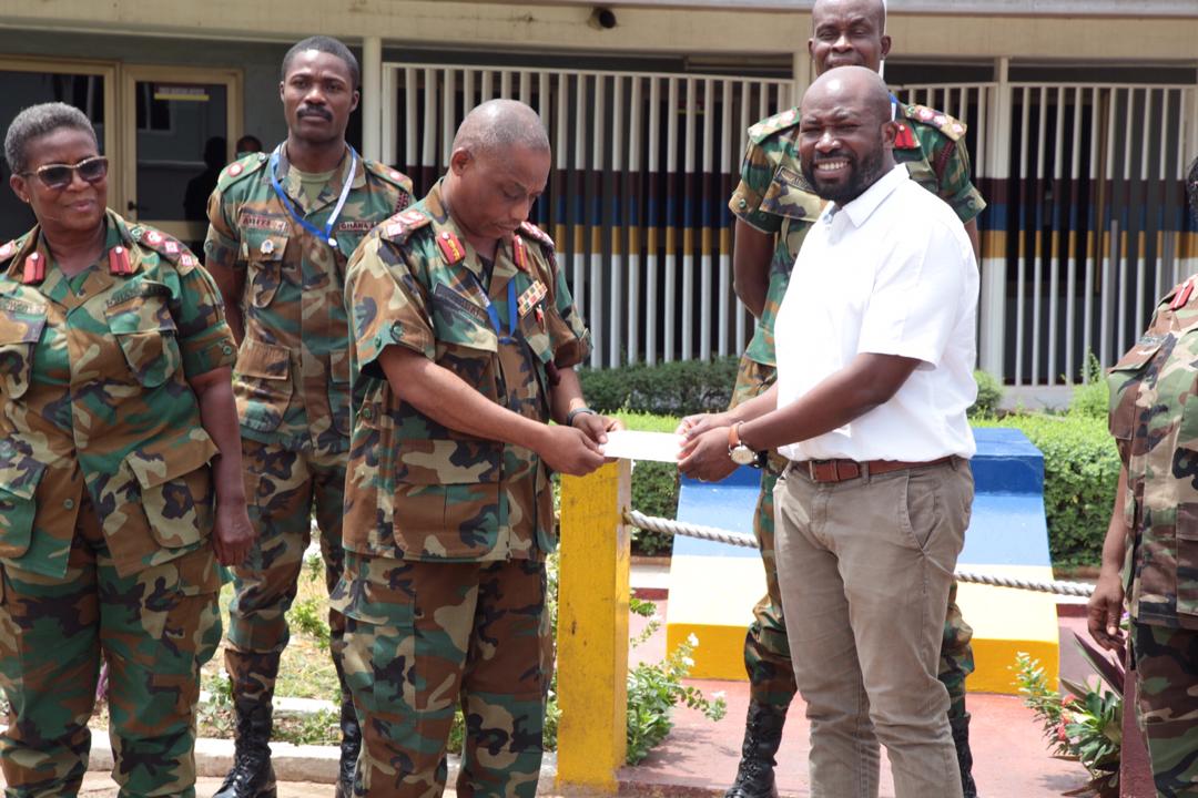 Brig-Gen. Nii Adjah Obodai receives a cheque from Senyo Hosi