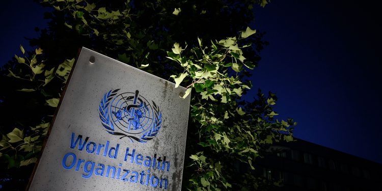 A photo taken in the late hours of May 29, 2020 shows a sign of the World Health Organization (WHO) at their headquarters in Geneva amid the COVID-19 outbreak, caused by the novel coronavirus. - President Donald Trump said May 29, 2020, he was breaking off US ties with the World Health Organization, which he says failed to do enough to combat the initial spread of the novel coronavirus. (Photo by Fabrice COFFRINI / AFP) (Photo by FABRICE COFFRINI/AFP via Getty Images)