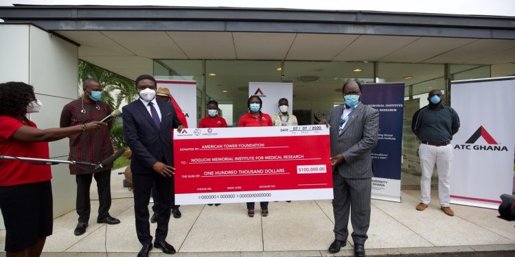 ATC Ghana Chief Executive Officer, Yahaya Yunusa (left) presenting the dummy cheque to Prof. Abraham Annan (right), Director of Noguchi Memorial Institute for Medical Research.