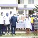 Mr. Isaac Kyei-Mensah (fourth from left) hands over a packet of latex gloves to Dr Salamatu Atta Nantogma